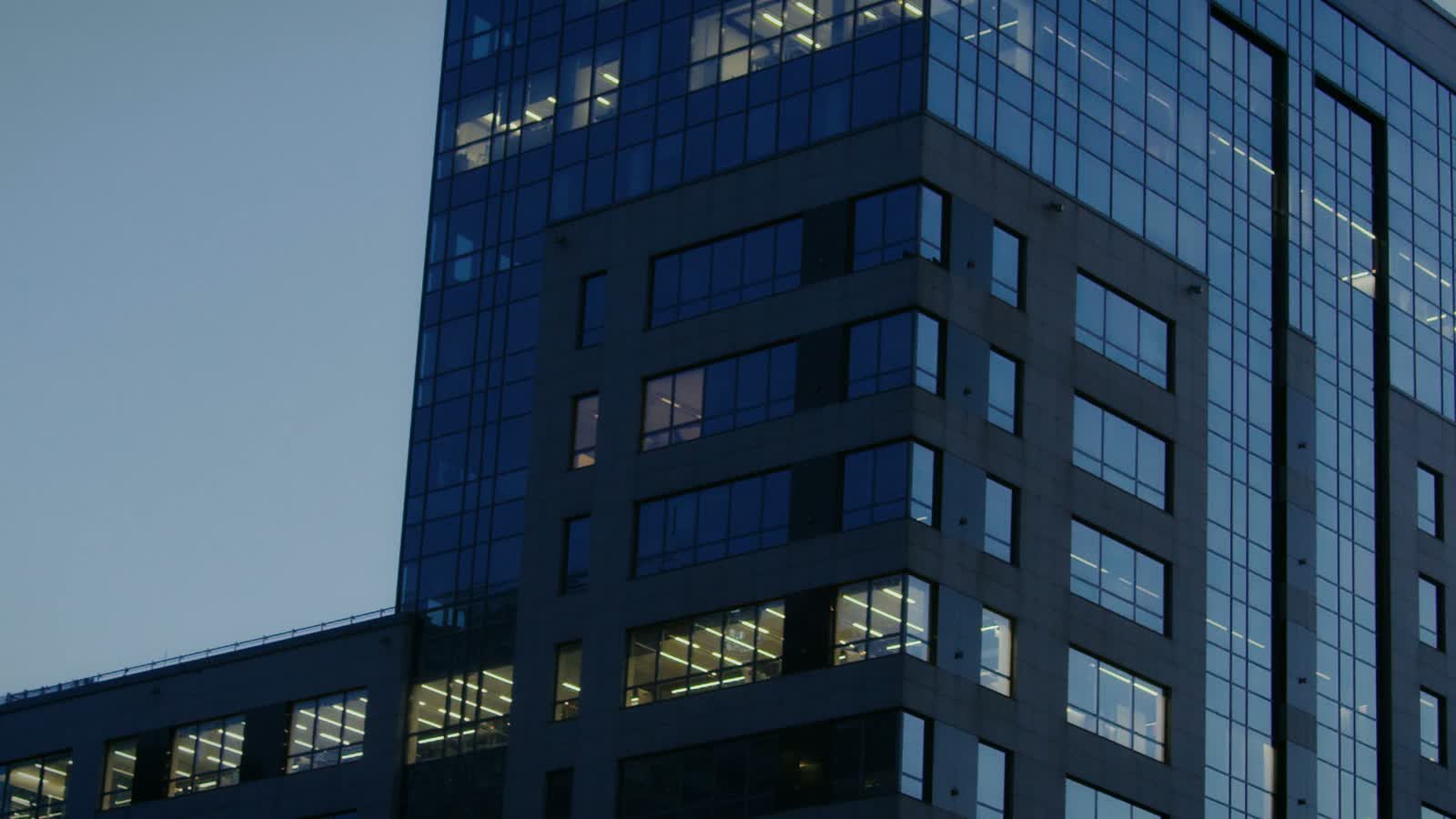Daylight on a modern architectural facade, used as a metaphor for a process becoming clearer.